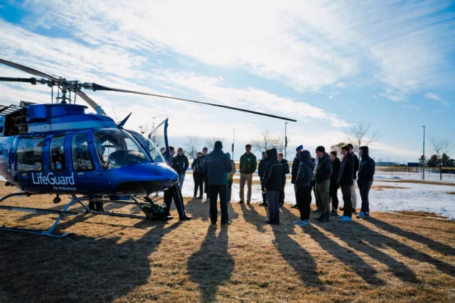 Viva Solutions training group beside a LifeGuard helicopter
