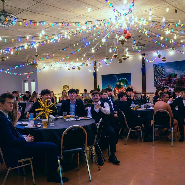 Guests seated at tables during a corporate banquet covered by Kruger Co.